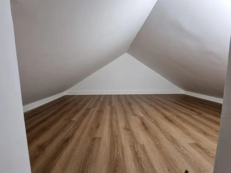 Plasterboarded and painted loft storage room with luxury vinyl plank flooring